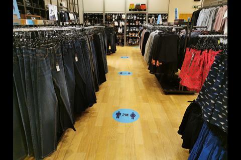 Next has installed floor stickers around the store to map out 2m distances between shoppers.